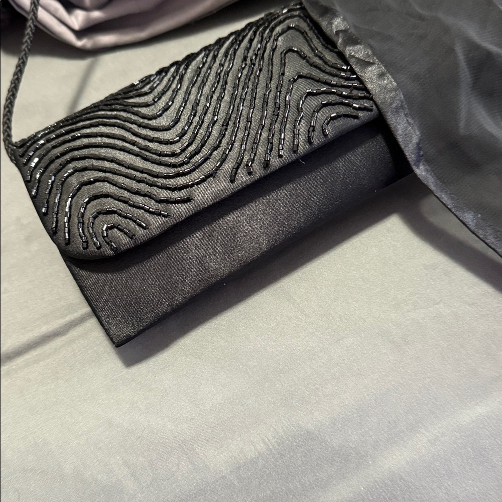 Elegant Black Beaded Evening Clutch
Plus free sheer shoulder wrap. - Picture 7 of 10